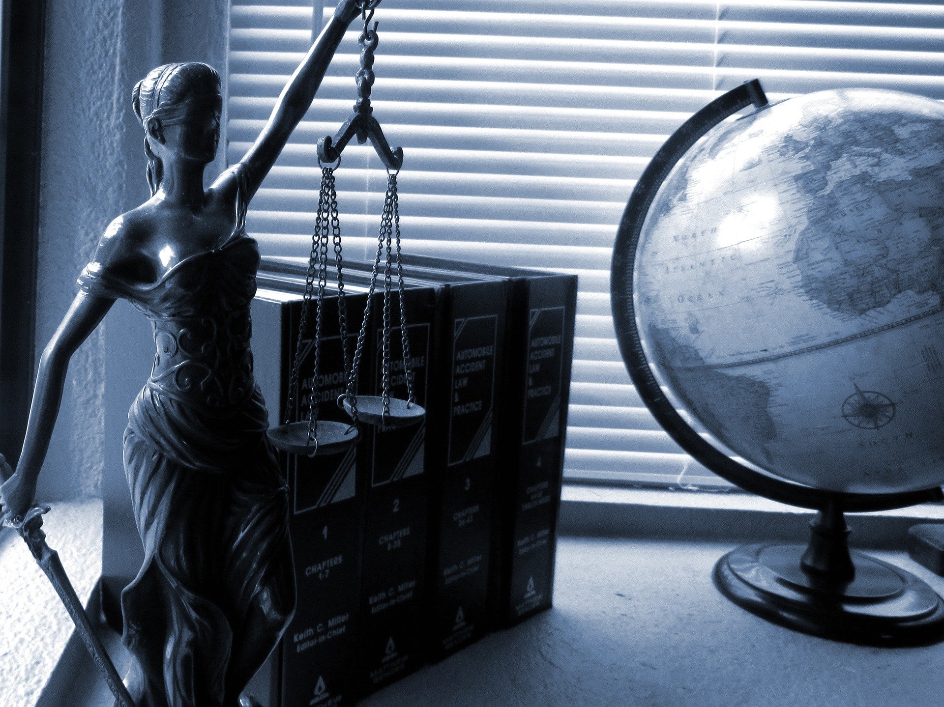 Lawyer figure and a globe of the world